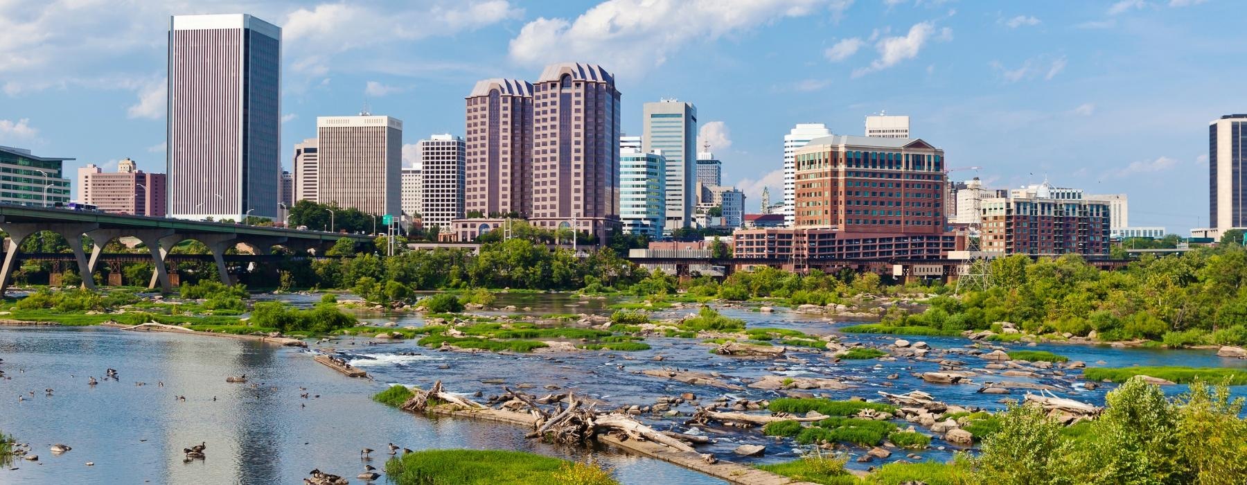 a city skyline with a river running through it