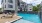 a pool with a building in the background