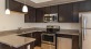 a kitchen with black cabinets
