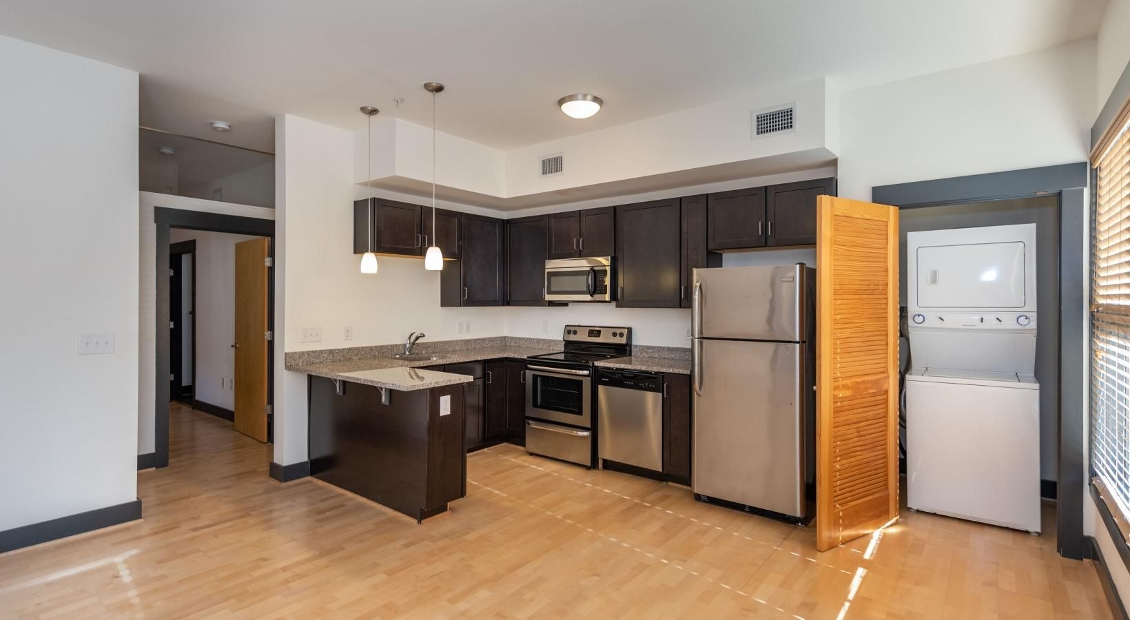Spacious kitchens with thoughtful details a kitchen with black cabinets