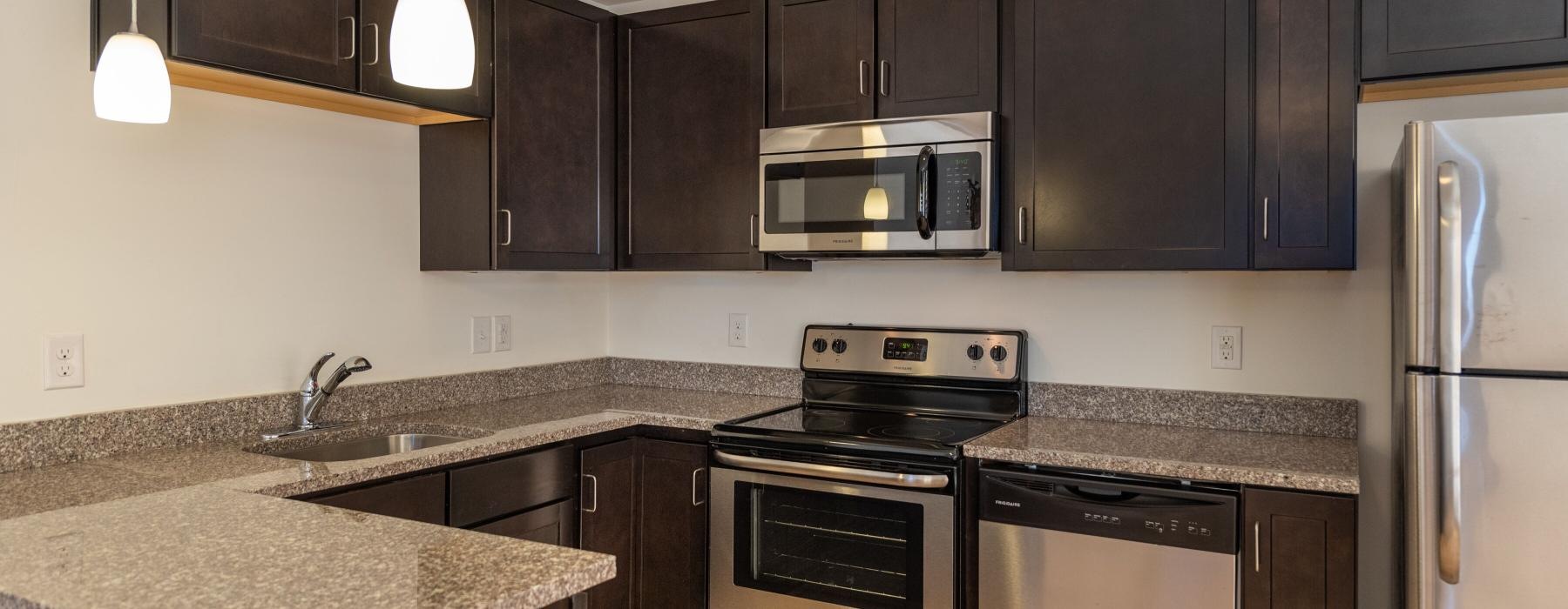a kitchen with black cabinets