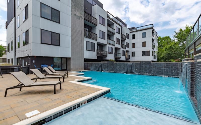 a pool with a building in the background