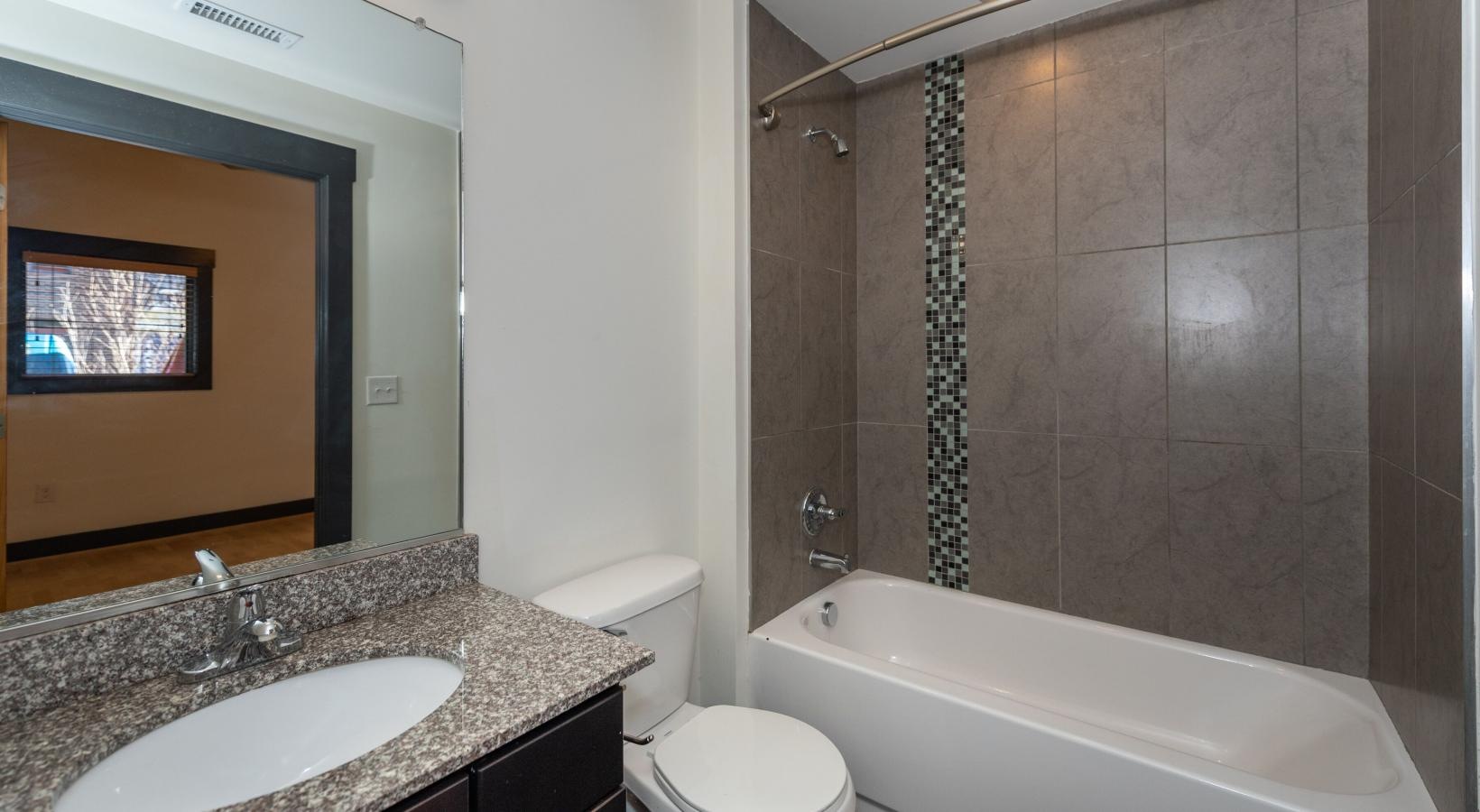 Spacious bathrooms with everything you need a bathroom with a sink and a toilet