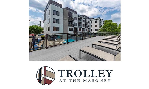 Trolley a logo and a outdoor lounge area