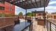a patio with a table and chairs