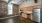 a kitchen with a brick wall