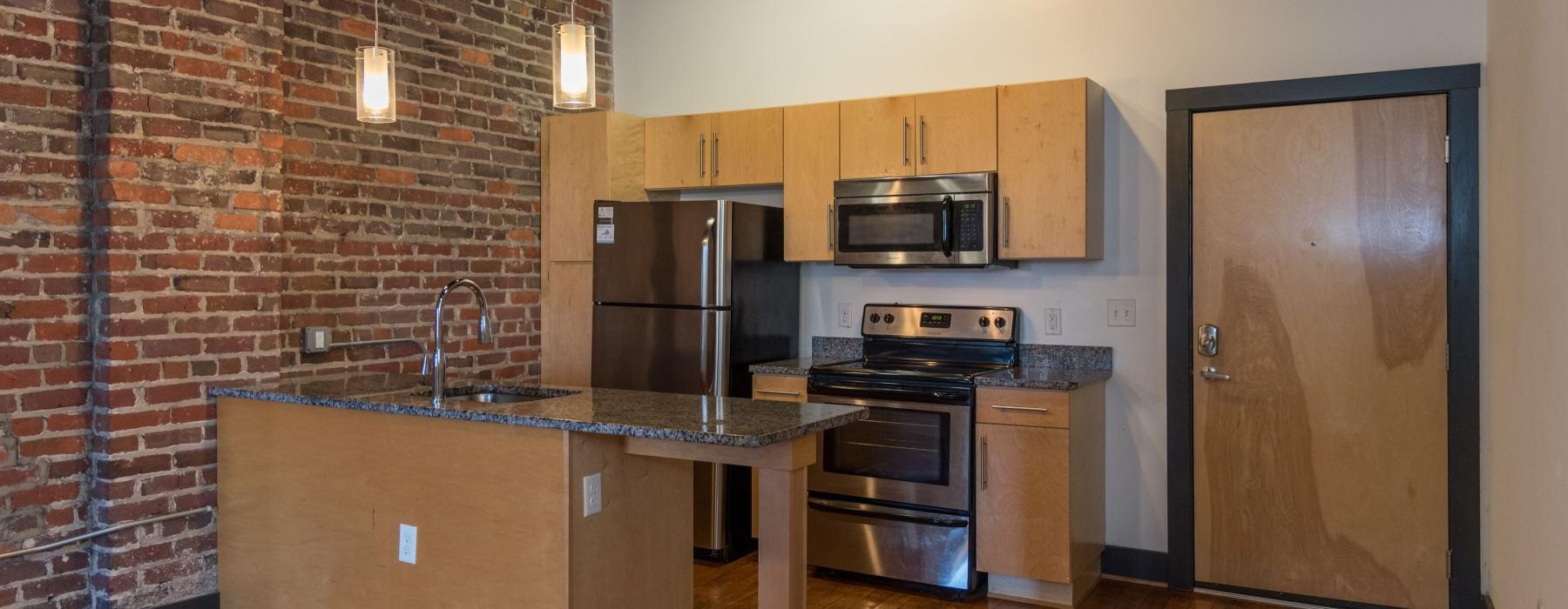 a kitchen with stainless steel appliances
