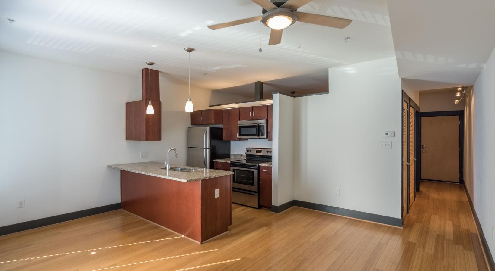 Spacious kitchens with thoughtful details a kitchen with a wood floor
