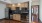 a kitchen with wooden cabinets