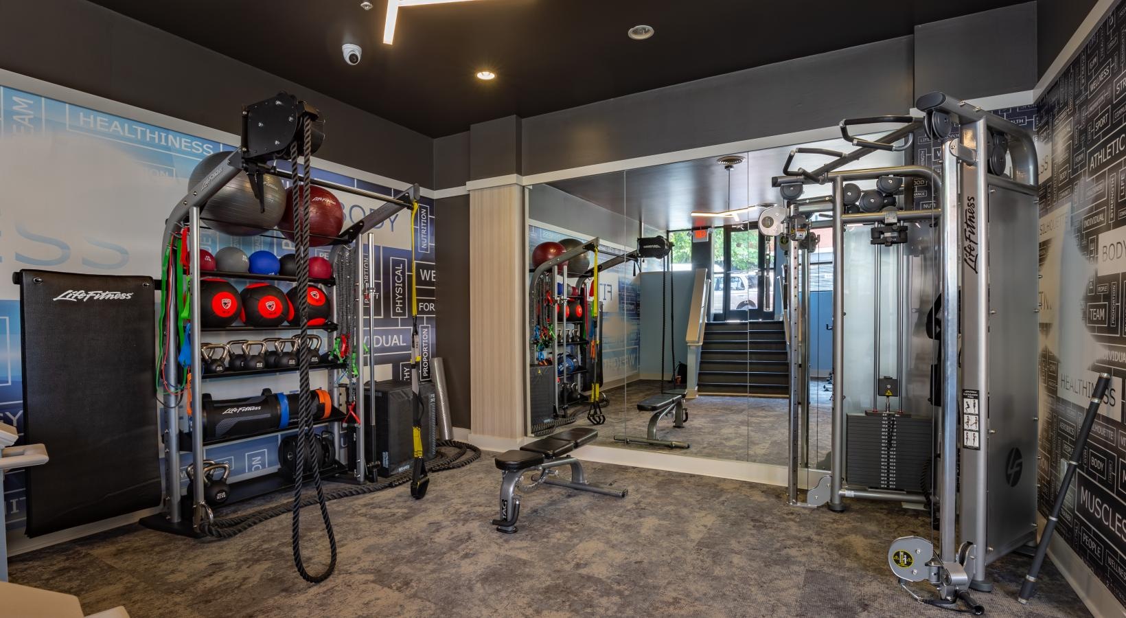 Get your workout on a room with machines and equipment